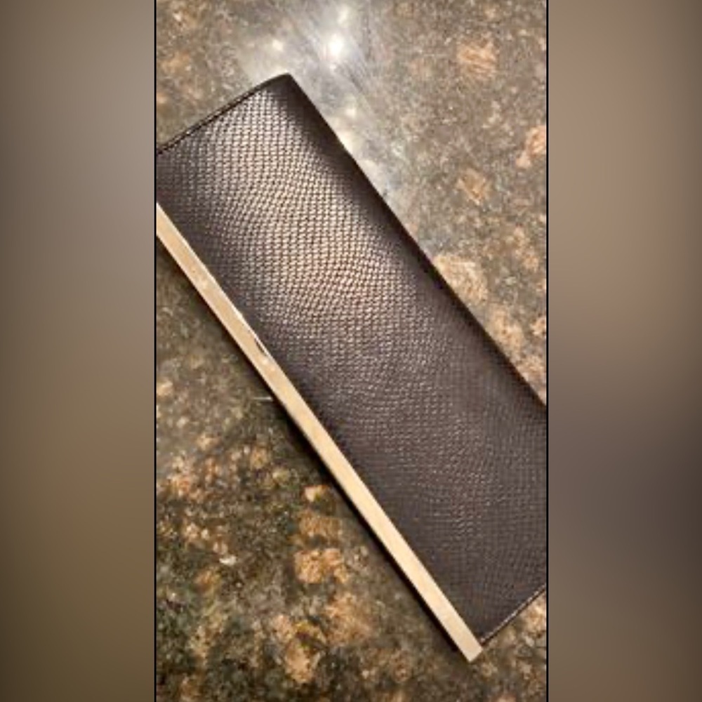 Costa Blanca X black clutch purse with snake skin look fabric and silver stripe